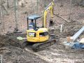 Cat 304c cr excavator in the mud