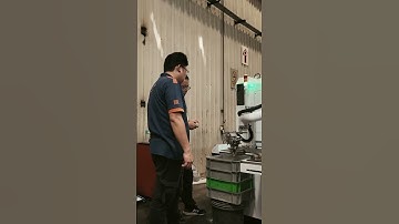 Slant Bed CNC Lathe Machine with Robot Arms to Auto-loads and Unloads