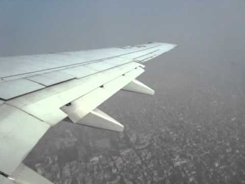 Boeing 737-700 JetLite, India, Delhi to Hyderabad. Note the slums below the airport after takeoff and all of the pollution which is called "fog" by the locals. It is in fact smoke from burning trash, smog from car and factories and a little bit of fog that is trapped and does not burn off. Sometimes visibility is limited to 50 yards/meters. It smells awful as well. That said, Hyderabad was perfectly clear and so was Bombay/Mumbai.