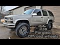 Color matched tahoe on 24 inch Forgiato offroad wheels