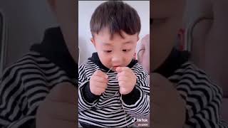 Funny cute child trying to put thread in needle 😂😂