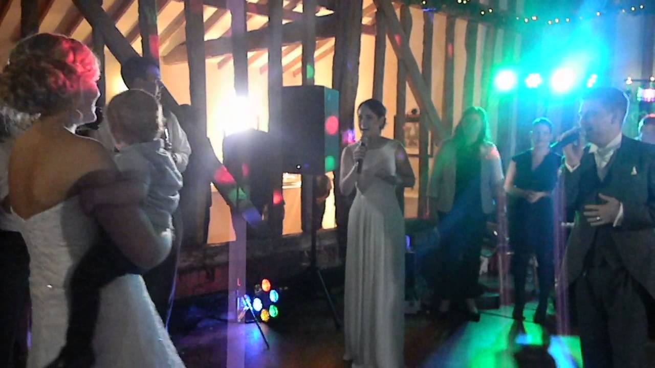 Groom surprises Bride with live rendition of Thinking Out Loud feat their wedding guests!