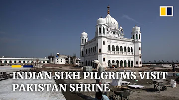 Indian Sikhs pilgrims cross border into Pakistan to visit holy site