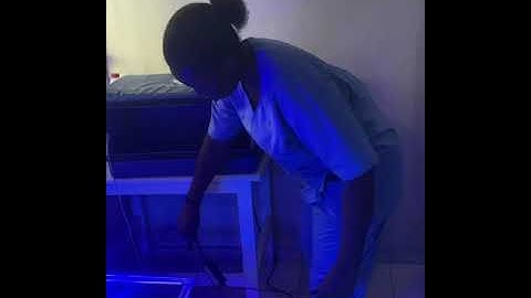 Nurse  setting up Crib A’glow Unit