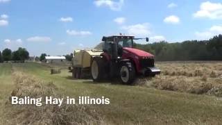 Baling Hay in illinois with a Versatile 260 tractor pulling a Krone Baler