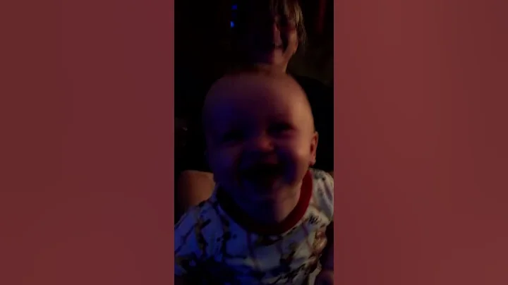 Baby laughing hard.