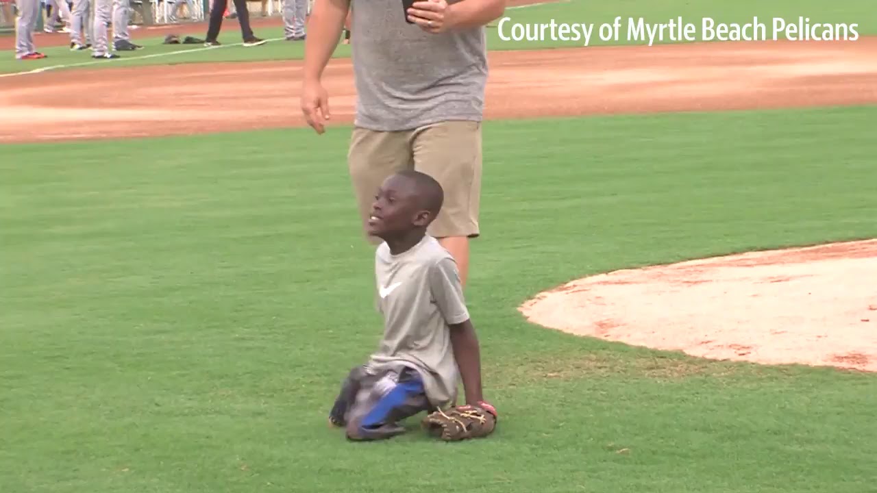 Cleveland boy without legs throws first pitch at Myrtle Beach Pelicans