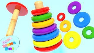 We are learning red, green, orange, purple, blue, and yellow colors with Wooden rainbow stacker ring