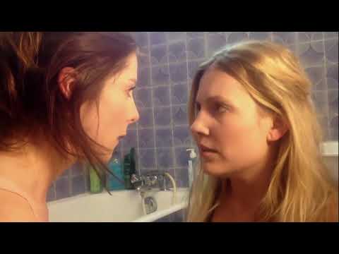 Two Lesbian girls doing pregnancy test -  kiss and fun in bathtub