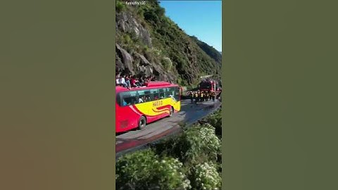 Bus Hangs Off Cliff Edge in Mountain Road | 30 People on Roof in Shocking Drone View