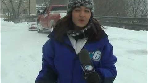 Plow trucks work to keep up with snow storm