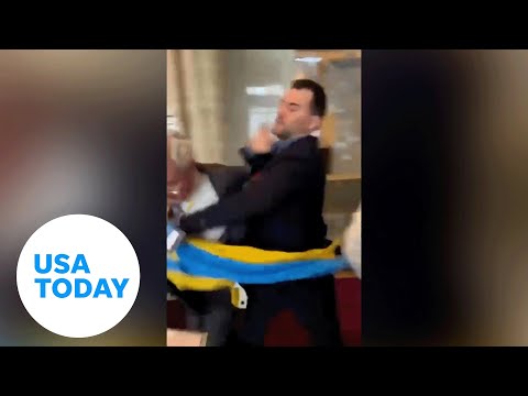 Ukrainian delegate punches Russian official after flag is swiped | USA TODAY