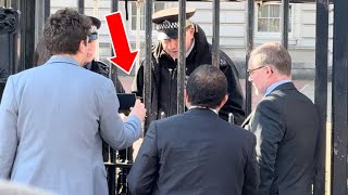 RARE SIGHTING! ID check at Buckingham Palace. Police officer uses giant key
