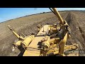Cat Grader cleaning channel for irrigation season