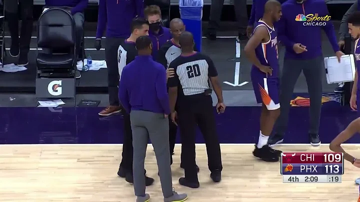 Denzel Valentine knocks over referee Leroy Richard...