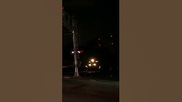 CSX cruises through the night under the block signals!