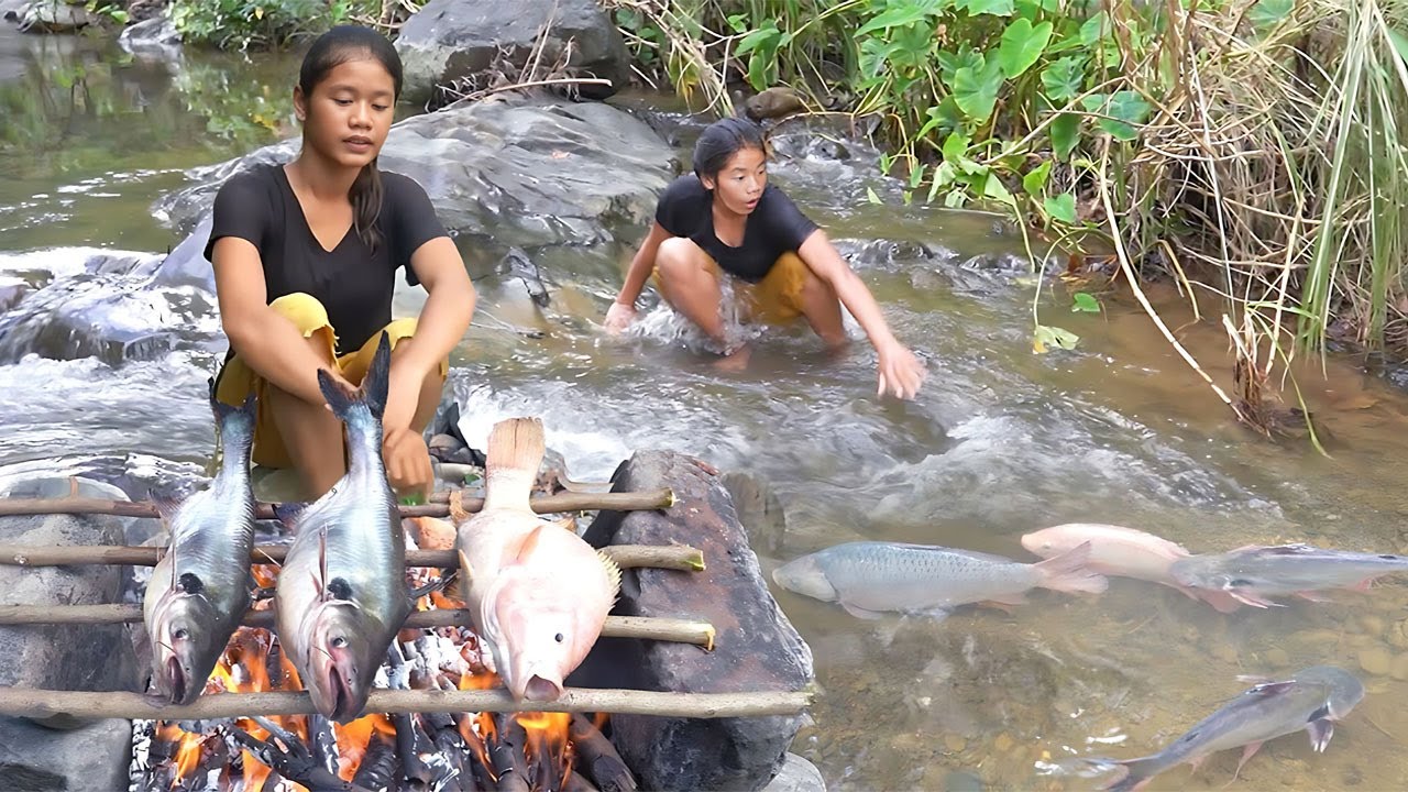 Solo girl in forest find food and catch fish to grill with chili sauce for eating