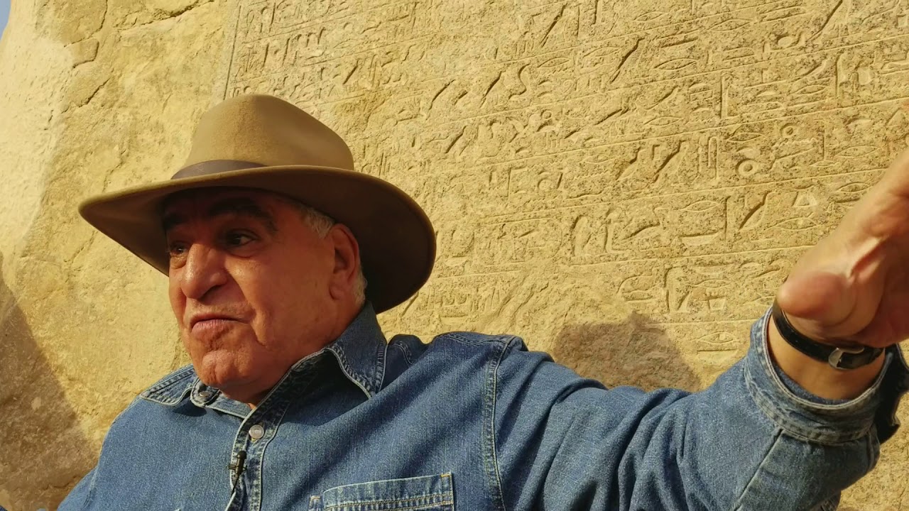 Dr Zahi Hawass explaining the tablet at the foot of the Sphinx in Egypt