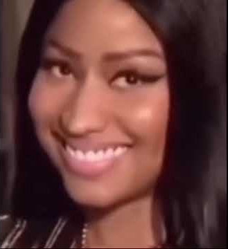 Stan Twitter: Nicki Minaj smiling and then looks around confused 😕