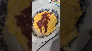 Japanese omelette rice. fried mixed Vegetable rice, ketchup and Worcestershire sauce.