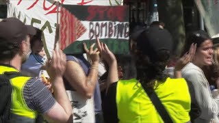 Lecturers and students at the University of Amsterdam walk out of lectures