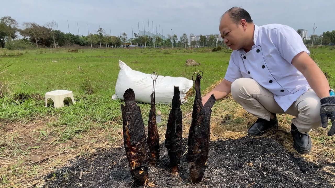 Grilled fish in straw pile in the east field // Asian chef