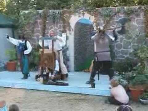 Heather Alexander gets her head "cut off" by Zinger The Magician at the Washington State Renaissance Faire.