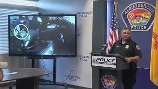 APD: Man shot in back of patrol vehicle while officers try to disarm him