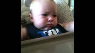 adorable baby eating oatmeal first time cute chubby fat funny laughing