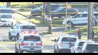 Woman caught in crossfire, shot and killed while driving