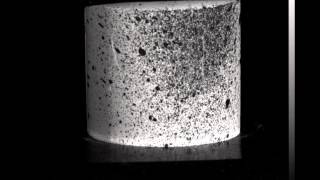 Fracture mechanism of a laminar ceramic structure under compressvive load in slow motion