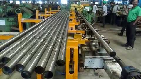 Automated loading and unloading of bright-bar  for center less grinders