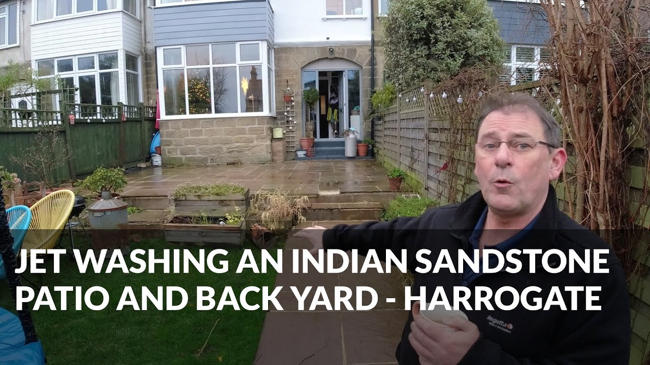 Pressure washing an Indian sandstone patio in Harrogate. jetreadyuk