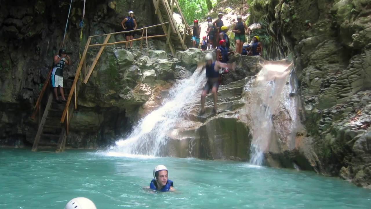 Jumping the final waterfall in the 27 Waterfalls of Rio Damajagua in the Dominican Republic