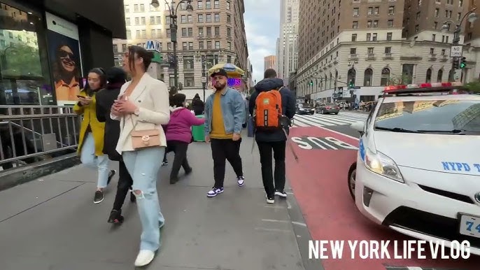 Creepy life-like robot of artist Yayoi Kusama spotted painting shop window  in New York