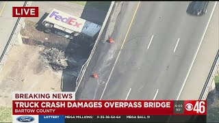 FedEx truck crashes through I-75 bridge in Bartow County