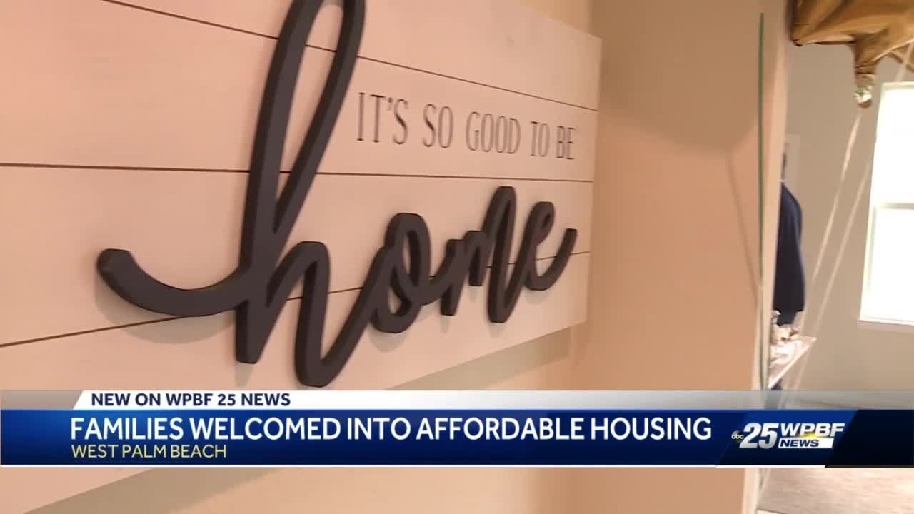 Palm Beach County's workforce housing program presents 4 families new homes