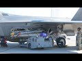 US Airmen Perform Weapon Load Drill on F-22 Raptor Jet