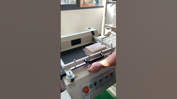 Semi-automatic shrink film packaging machine