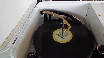 Magnavox micromatic automatic record player playing a stack of 45