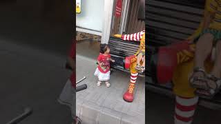 BABY PLAYING WITH MACDONALDS STATTUE MASHALLAH