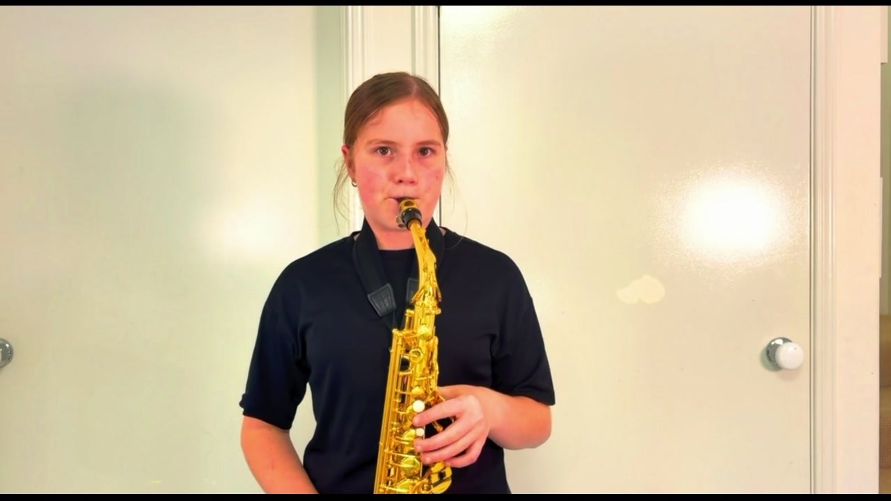 Hot Cross Buns #17 — Olivia playing alto saxophone