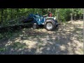 Cutting down trees with a tractor