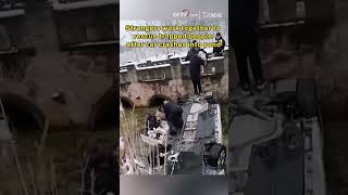 Strangers work together to rescue trapped people after car crashes into pond