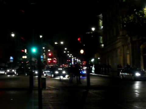 A MB Sprinter of the London Ambulance Service clears the road for an unmarked police car (VW Passat) of the Metropolitan Police London at Trafalgar Square, London