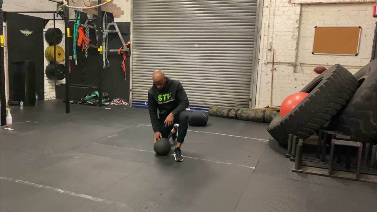 Half kneeling med ball rotational slams