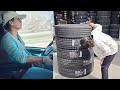 Female truck driver wei xiaoyang changes truck tires and heads home