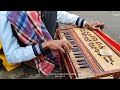 An absolute harmonium player at darjeeling  beautiful harmonium playing of a beggar 