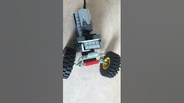 Lego return to center steering system