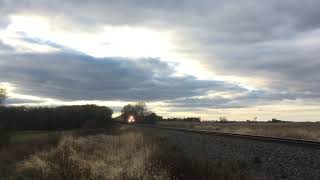 CN SD75 leads BNSF Stacktrain on the aurora sub